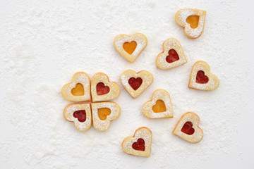 Romantic linzer cookies filled with strawberry and apricot jam
