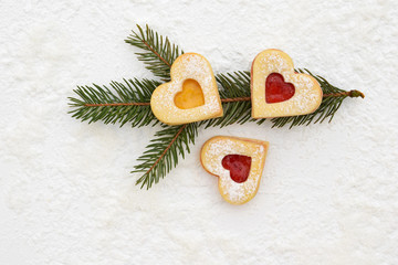 Fototapeta na wymiar Romantic linzer cookies filled with strawberry and apricot jam