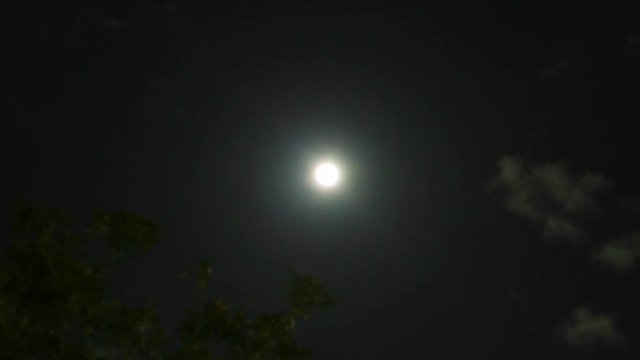 Centered Moon as clouds move at night