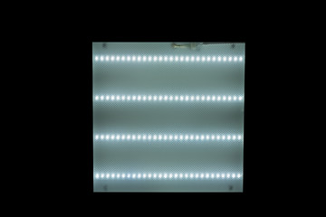 ceiling square lamp with fluorescent lamps on black background
