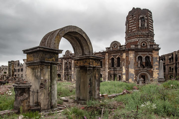 Post-war landscape. Abandoned city after the war. War ruins. Destroyed city after bomb attack. Dead...
