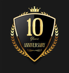 Golden shield and laurel wreath anniversary retro design 10 years 