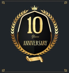 Golden shield and laurel wreath anniversary retro design 10 years 