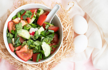Tomatoes and cucumber, fresh vegetable salad in bowl.