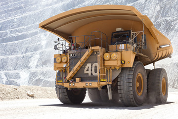Fototapeta na wymiar Huge dump truck in a open pit copper mine in northern Chile