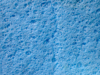 Fototapeta na wymiar Macro close up of blue sponge for washing.Inside of blue sponge for washing. extreme close up