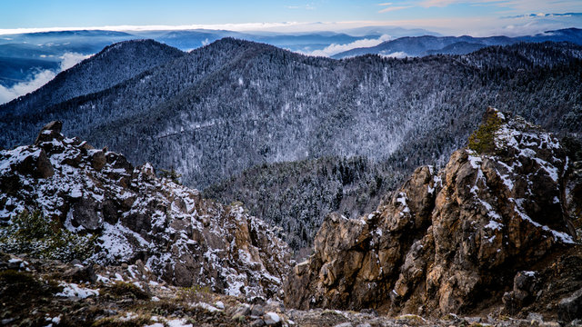 Misty white clouds forming on top of a rocky mountain / yenice forest in karabuk turkey	