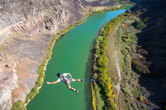 A BASE jumper leaps off the 486-foot Perrine Bridge in Twin Falls, Idaho over the Snake River. The bridge is the only manmade structure in the U.S. that is legal to jump from and therefore is a popular destination for BASE.