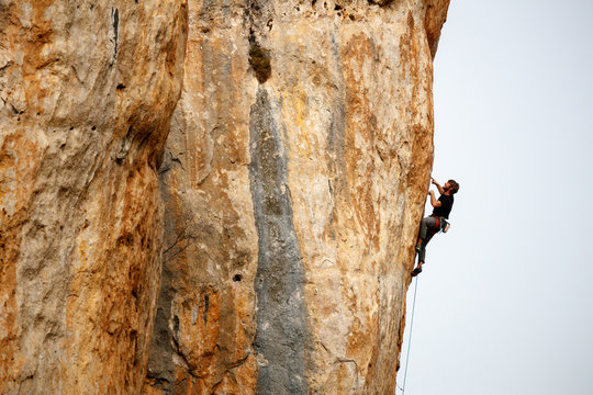 Man climbing at rocky wall, Cuenca, Spain