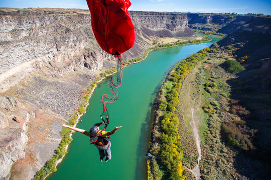 A BASE jumper leaps off the 486-foot Perrine Bridge in Twin Falls, Idaho over the Snake River. The bridge is the only manmade structure in the U.S. that is legal to jump from and therefore is a popular destination for BASE.