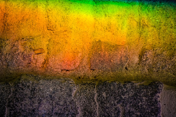Background or texture from a rainbow on a concrete tile. Light change through glass. Prism.