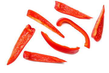 cut slices of red sweet bell pepper isolated on white background top view