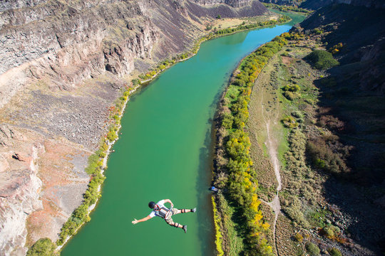 A BASE jumper leaps off the 486-foot Perrine Bridge in Twin Falls, Idaho over the Snake River. The bridge is the only manmade structure in the U.S. that is legal to jump from and therefore is a popular destination for BASE.