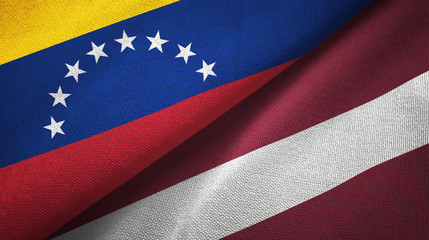 Fototapeta premium Venezuela and Latvia two flags textile cloth, fabric texture