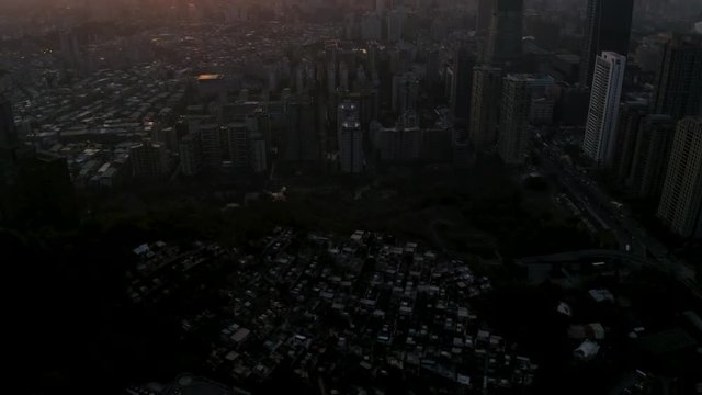 4k Aerial drone footage - Skyline of the city of Taipei, Taiwan at sunset.  