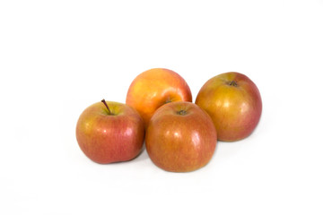 Apples red green yellow ripe on a white background.