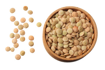Pile lentil in wooden bowl isolated on white background. Top view.