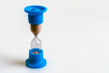 Hourglass on white.