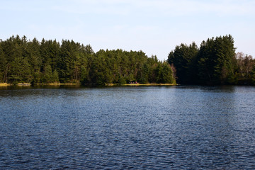 Lake near the forest. Landscape with a lake on a sunny spring day. Rennesoy, Rogaland, Norway