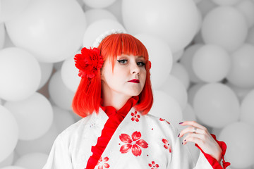 girl in kimano on the background of balls