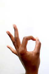 black african female hand gesturing on an isolated white background - pointing, ok sign, thumbs up, offensive gesture, open hand