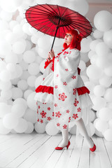 girl in kimano on the background of balls