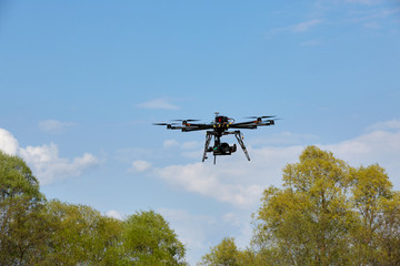 Fototapeta na wymiar Octocopter flight over the forest. unmanned aerial vehicle. photographing from the air.