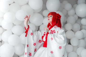 girl in kimano on the background of balls