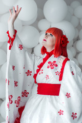 girl in kimano on the background of balls