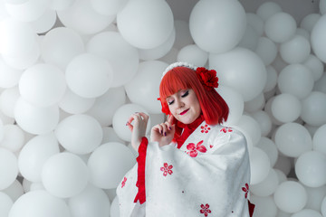 girl in kimano on the background of balls