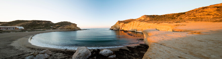 Sunrise in the beach, Cala Cocedores, Spain