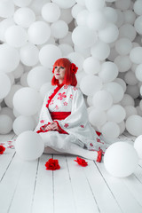 girl in kimano on the background of balls