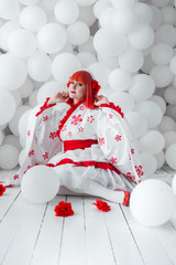 girl in kimano on the background of balls
