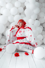 girl in kimano on the background of balls