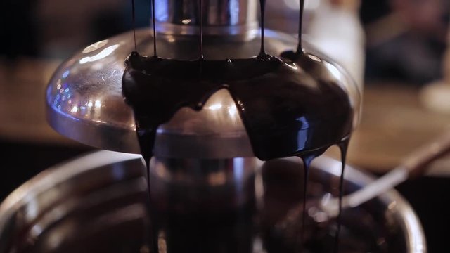 Motion of chocolate fountain inside restaurant