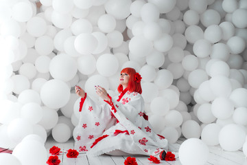 girl in kimano on the background of balls