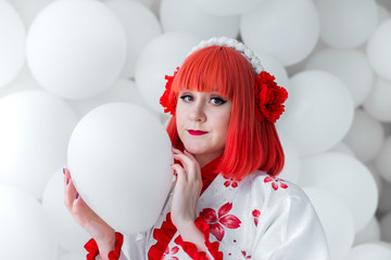 girl in kimano on the background of balls
