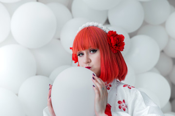 girl in kimano on the background of balls
