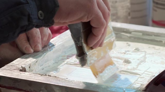 Close-up Of The Hand Of A Typography Worker Paint