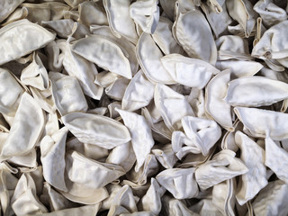 raw frozen dumplings in a supermarket by weight. Traditional dish of Ukraine and Russia. vareniki