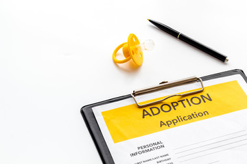 Application to adopt child with dummy on white background