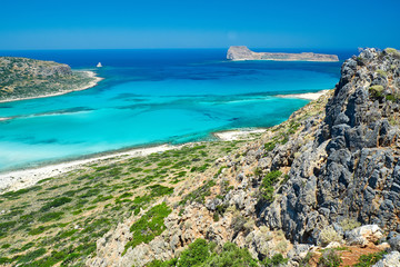 Gramvousa Castle and Laguna Balos, Crete. Beautiful beach with clear blue water. View of the island from the opposite shore.