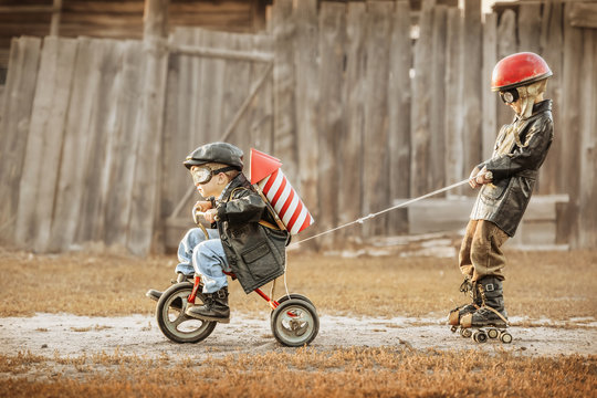 Naklejki Children play in the rider and the rocketman