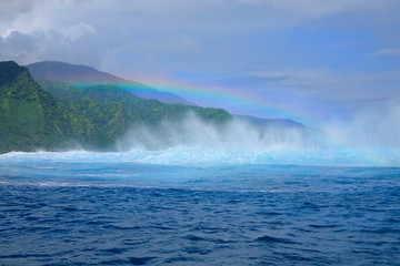 DRONE: Flying towards the beautiful breaking teahupoo wave in sunny Tahiti.