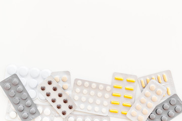 Pills on white background top view copyspace