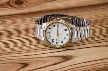 wrist watches on wooden background