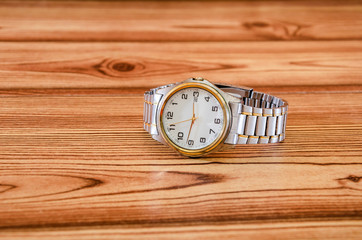 wrist watches on wooden background