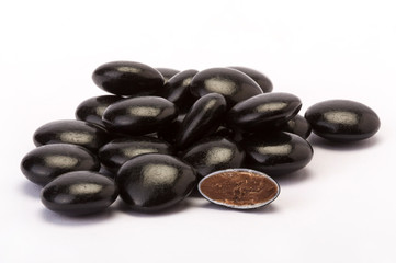 dragees with chocolate filing on white background