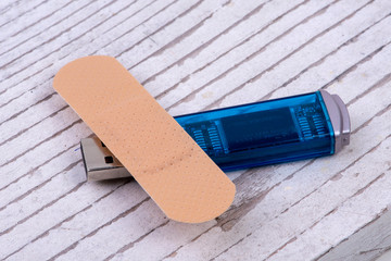 paving lies over a data stick on white rustic wood