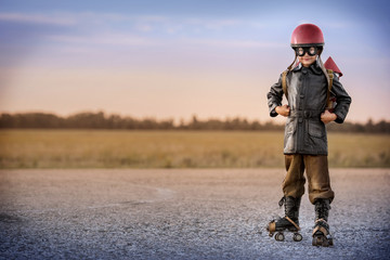 Portrait of a boy-rocketman at sunset